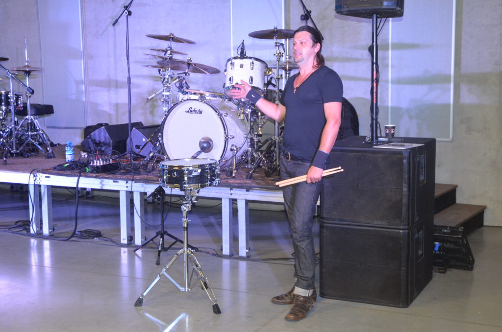 Drummer demonstrating snare drum techniques